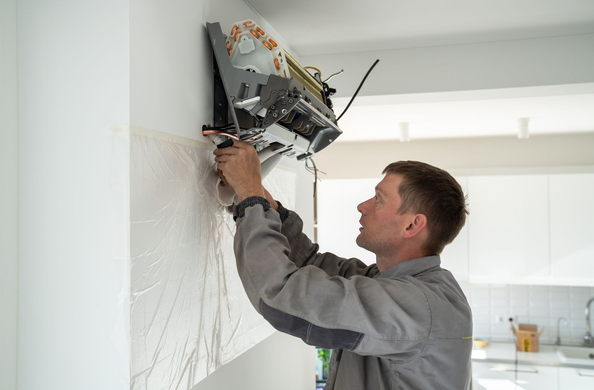 A technician performing Ductless AC Installation in Everett, WA,