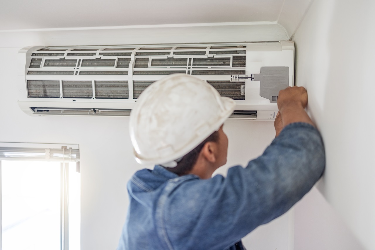 A technician performing AC Maintenance in Everett, WA