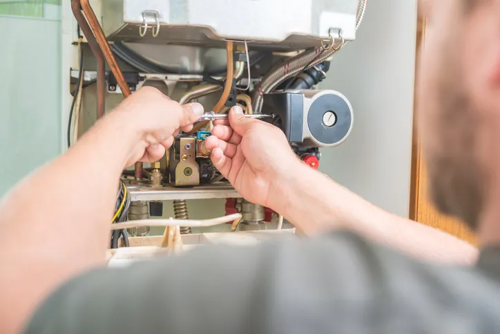 A technician performing Heating Service in Everett, WA