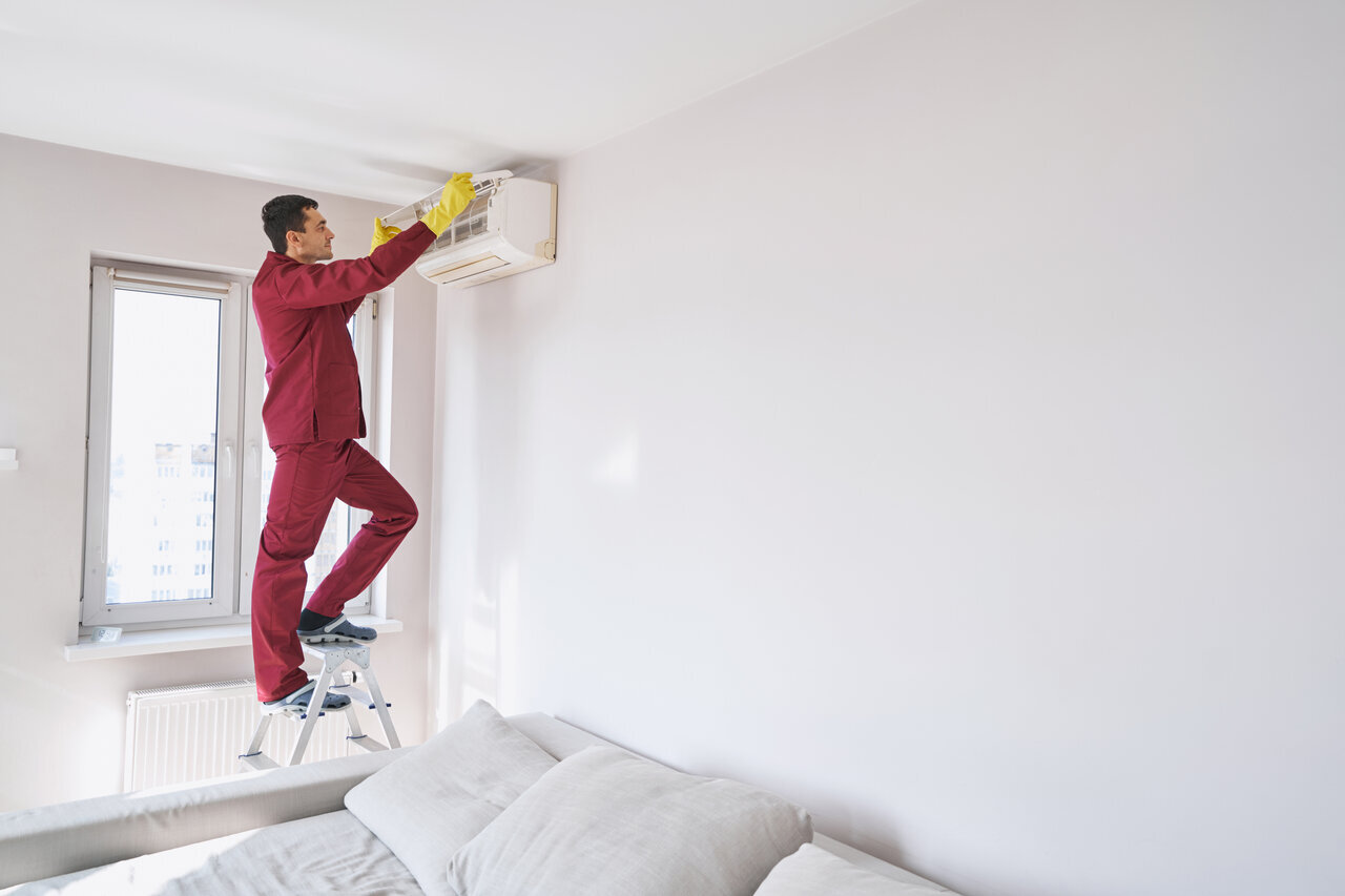 A technician performing AC installation in Woodinville, WA